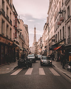 street photography of cars between buildings thumbnail