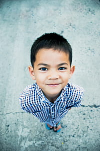 boy wearing blue and white sport shirt thumbnail