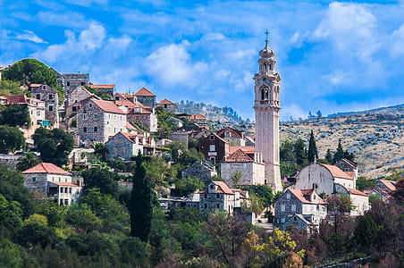 houses and towers on the mountain side thumbnail