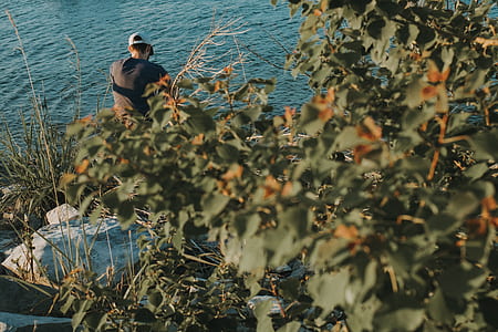 man beside body of water thumbnail