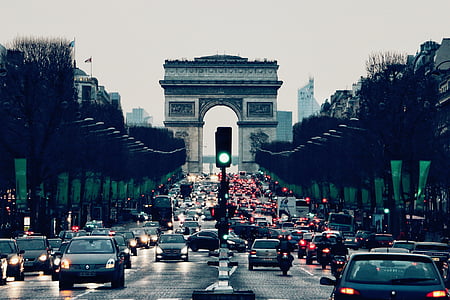 photo of arc de triomphe with vehicle passing by thumbnail