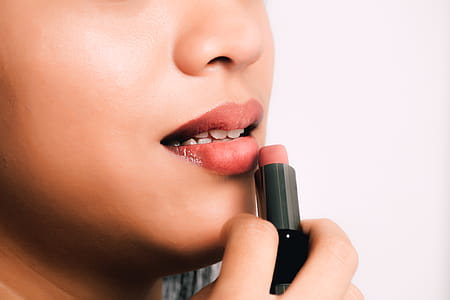 Woman Using Pink Lipstick thumbnail
