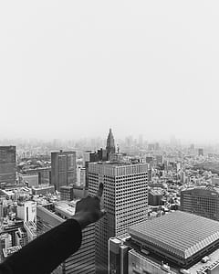 greyscale photography of person pointing at Chrysler Building thumbnail