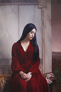 woman wearing red v-neck long-sleeved dress sitting on gray brown and white textile thumbnail