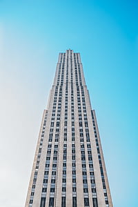 low-angle photography of white concrete building under blue sky during daytime thumbnail