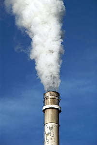 chimney emitting smoke under clear sky thumbnail