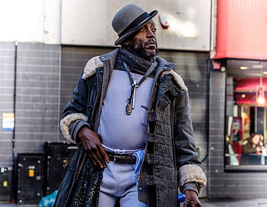 man waking with hand on pocket thumbnail