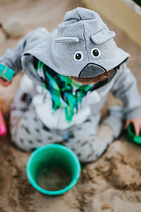 Toddler playing in the sand thumbnail