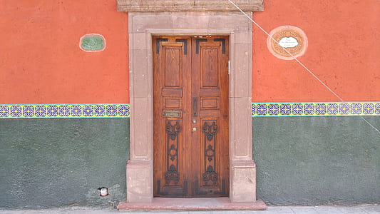 closed brown wooden door with gray frame thumbnail
