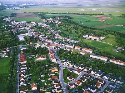 aerial photography of buildings near grass field at daytime thumbnail