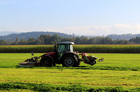 red and black tractor on pasture thumbnail