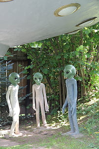 three alien statues under spaceship thumbnail