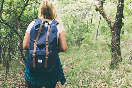 woman walking inside a forest thumbnail