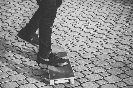 person standing on wooden skateboard thumbnail