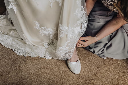 person putting on white shoe thumbnail