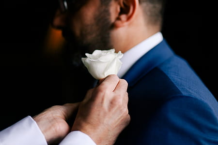 man holding white rose flower thumbnail