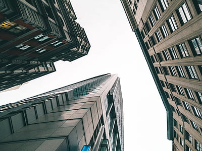 low angle photography of three high-rise buildings thumbnail