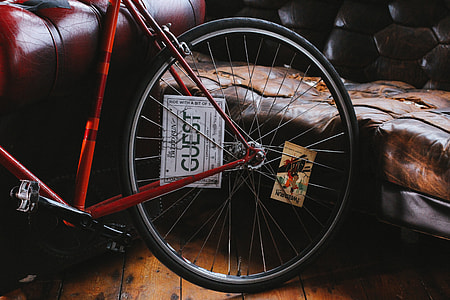 closeup photo of multi-spoke bicycle wheel near the sofa thumbnail