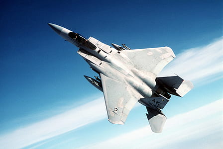 gray fighter plane on air near white clouds thumbnail