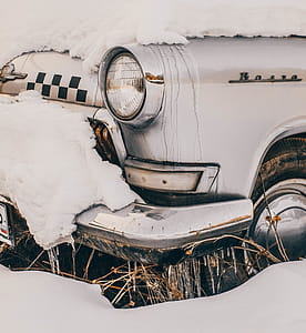 Close-Up Photography of Vintage Car Covered With Snow thumbnail