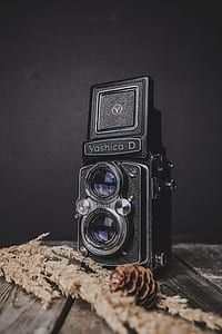 black Yashica-D land camera on brown surface thumbnail