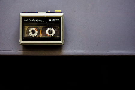 black and white cassette on gray wall thumbnail