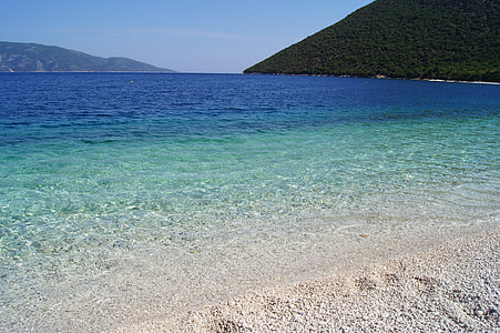 beach near island at daytime thumbnail