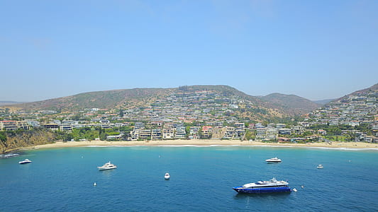 aerial photography of blue and white cruise ship during daytime thumbnail