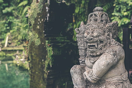 statuete near body of water thumbnail
