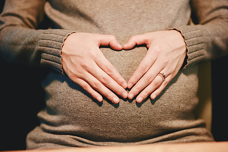 woman holding her tummy thumbnail