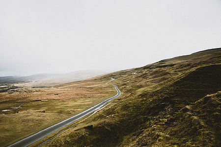 aerial view of asphalt road on body of mountain thumbnail