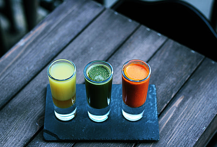 three shot glasses with liquors thumbnail
