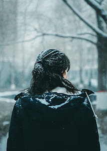 person standing outdoor while snowing thumbnail