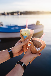 Man and Woman Holding Ice Creams thumbnail