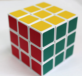 solved 3x3 rubik's cube on white surface thumbnail