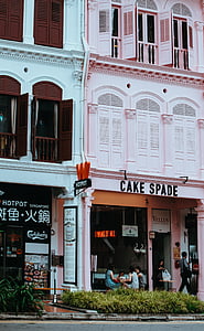 cake spade concrete building beside blue concrete building thumbnail