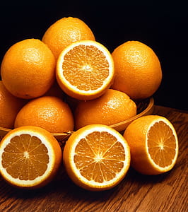 still life photo of bunch of orange fruits thumbnail
