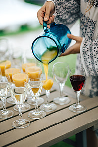 Glasses with wine and orange juice thumbnail