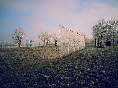 black and white fence on green field grass during daytime thumbnail