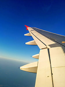 grey jetliner wing with red wingtip thumbnail