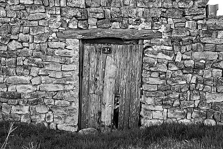grayscale photo of closed wooden door thumbnail