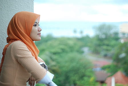 woman standing at the balcony thumbnail