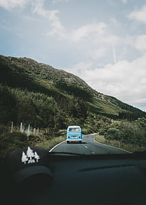 blue camper van near body mountain thumbnail