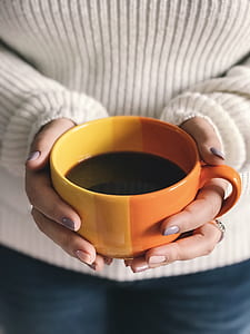 person holding cup of coffee thumbnail