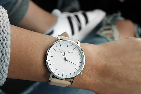 round white and silver-colored analog watch with brown leather strap thumbnail