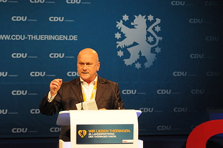 man talking on stage thumbnail