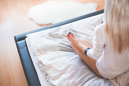 Young Girl Starting New Day with Meditation in Her Bed thumbnail