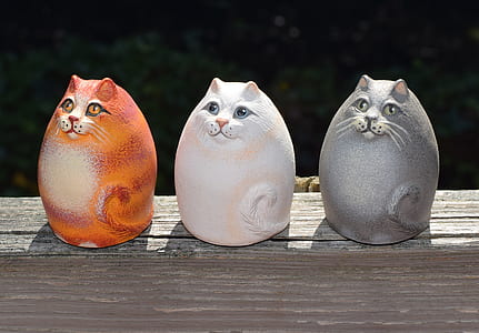 ceramic orange, white, and gray cat figurines thumbnail
