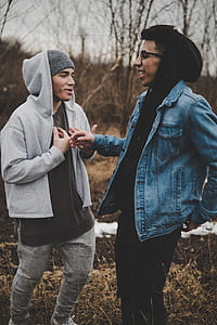 selective focus photography of two men in front of each other thumbnail