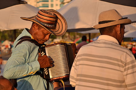 man playing wind instrument during daytime thumbnail